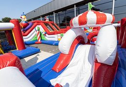 Bestellen sie eine aufblasbare zirkus-hüpfburg mit rutschen  und lustigen hindernissen mit aufdruck für kinder. Kaufen sie hüpfburgen online bei JB-Hüpfburgen Deutschland