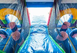 Hüpfburg mit einhorn-thema mit rutsche und 3D-objekten für kinder. Bestellen sie hüpfburgen online bei JB-Hüpfburgen Deutschland